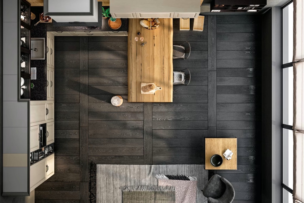Cucina vista dall'alto con tavolo in legno massello, sgabelli, penisola e pavimento scuro a doghe